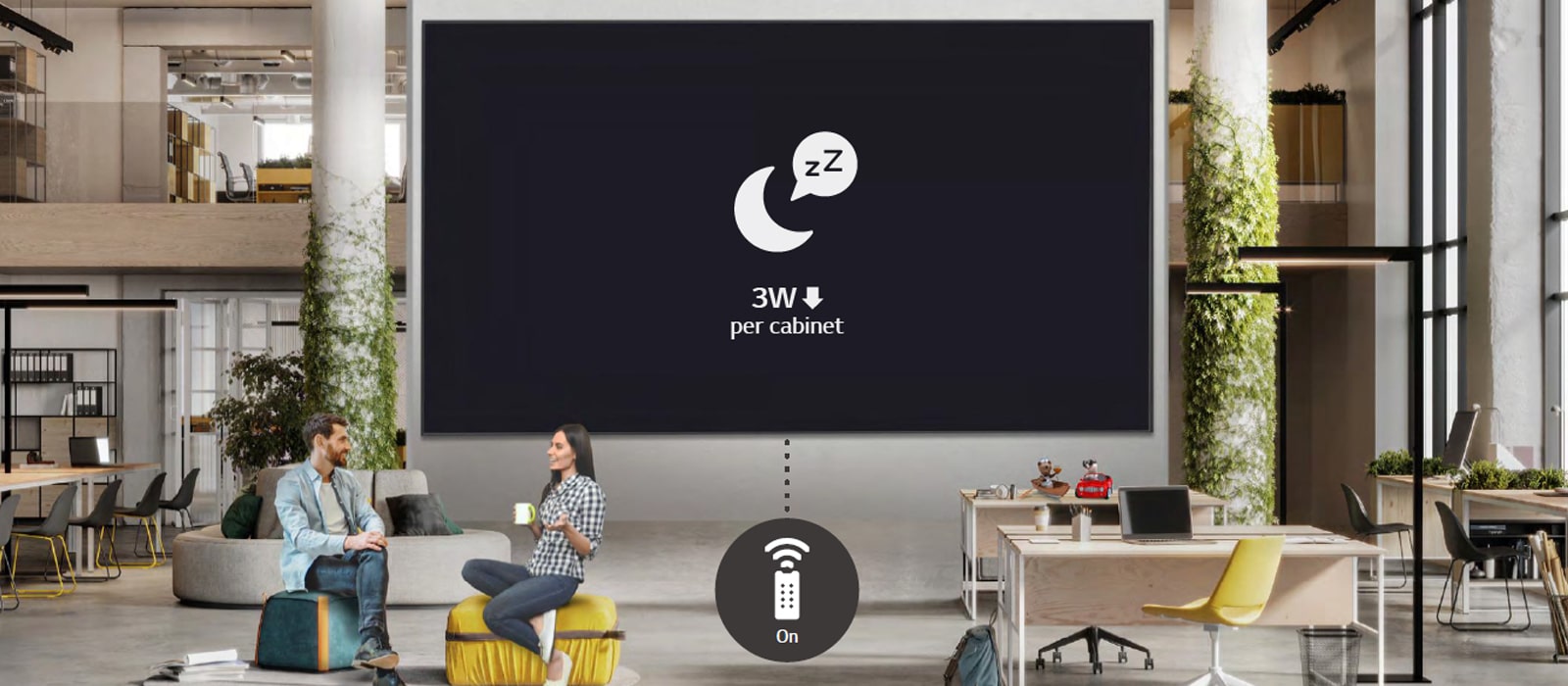 Employees are resting in the office without using the display which is in standby mode for minimizing power consumption. 